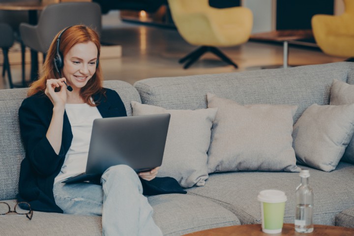 Woman working from her living room.