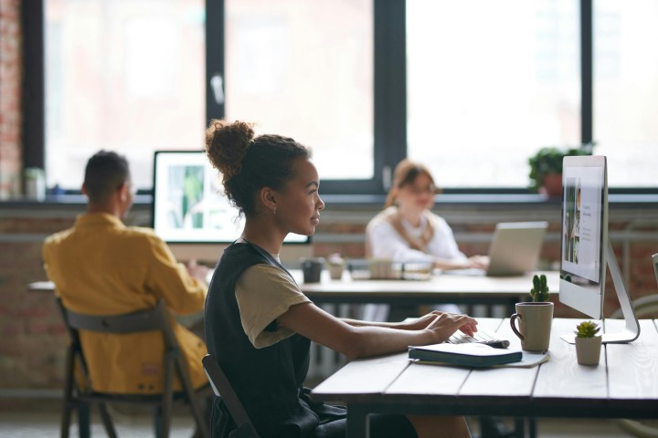 woman sitting at her desk.